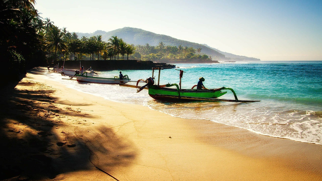 Bali, view beach with boats and palm trees